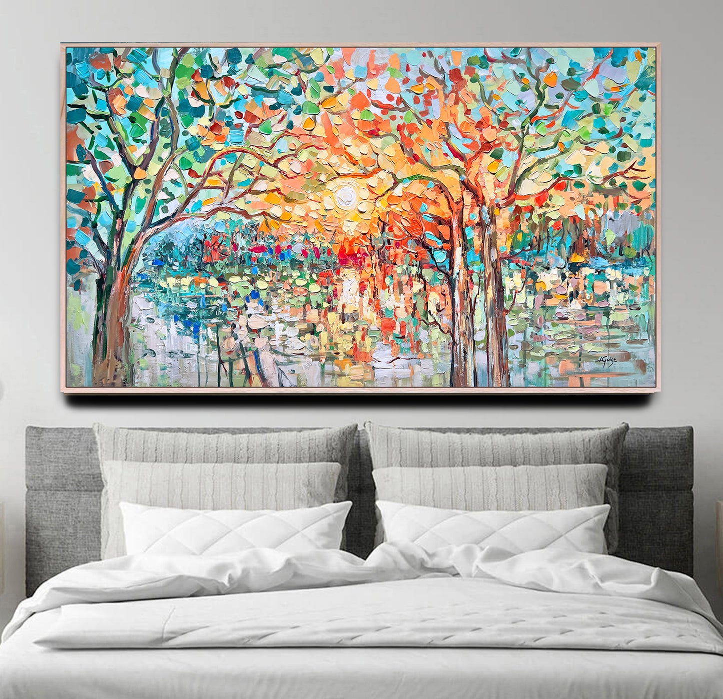 a large painting on a wall above a bed