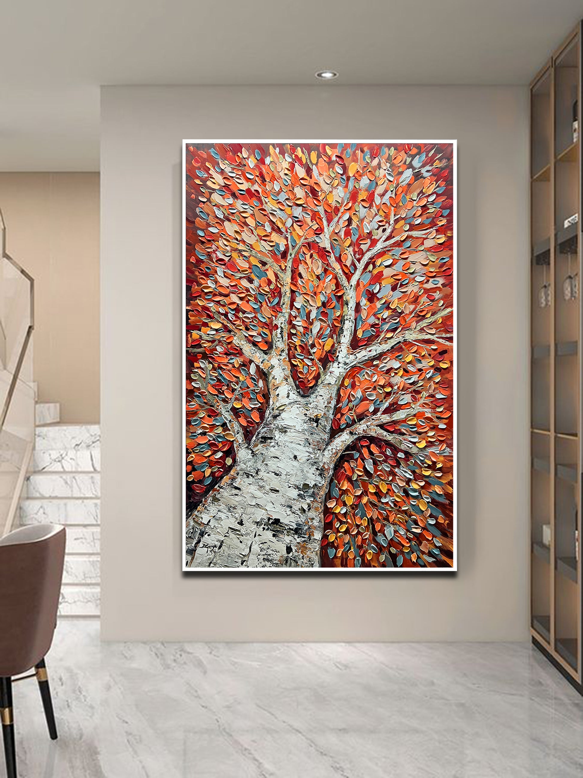 a painting of a tree in a living room