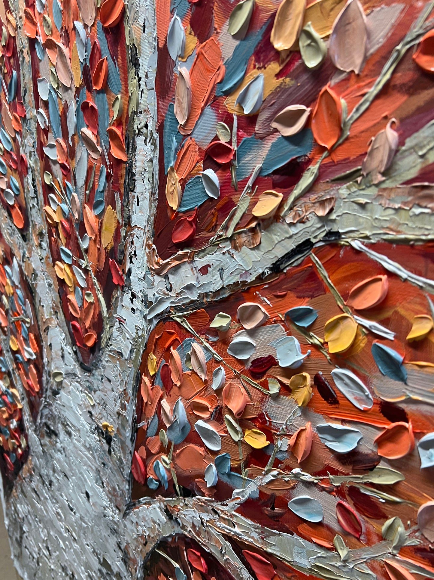 a painting of a tree with lots of leaves on it