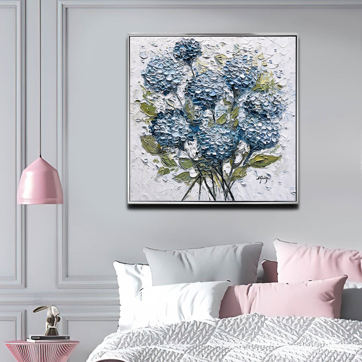 a painting of blue flowers on a white wall above a bed