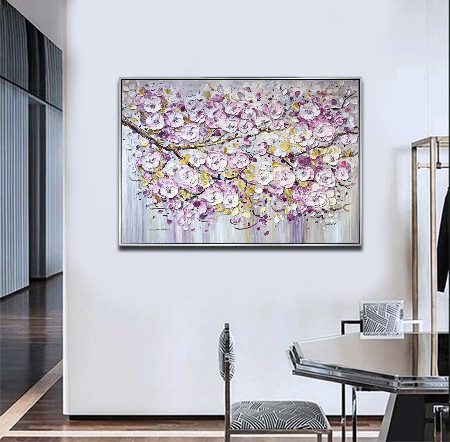 a painting hanging on a wall above a dining room table