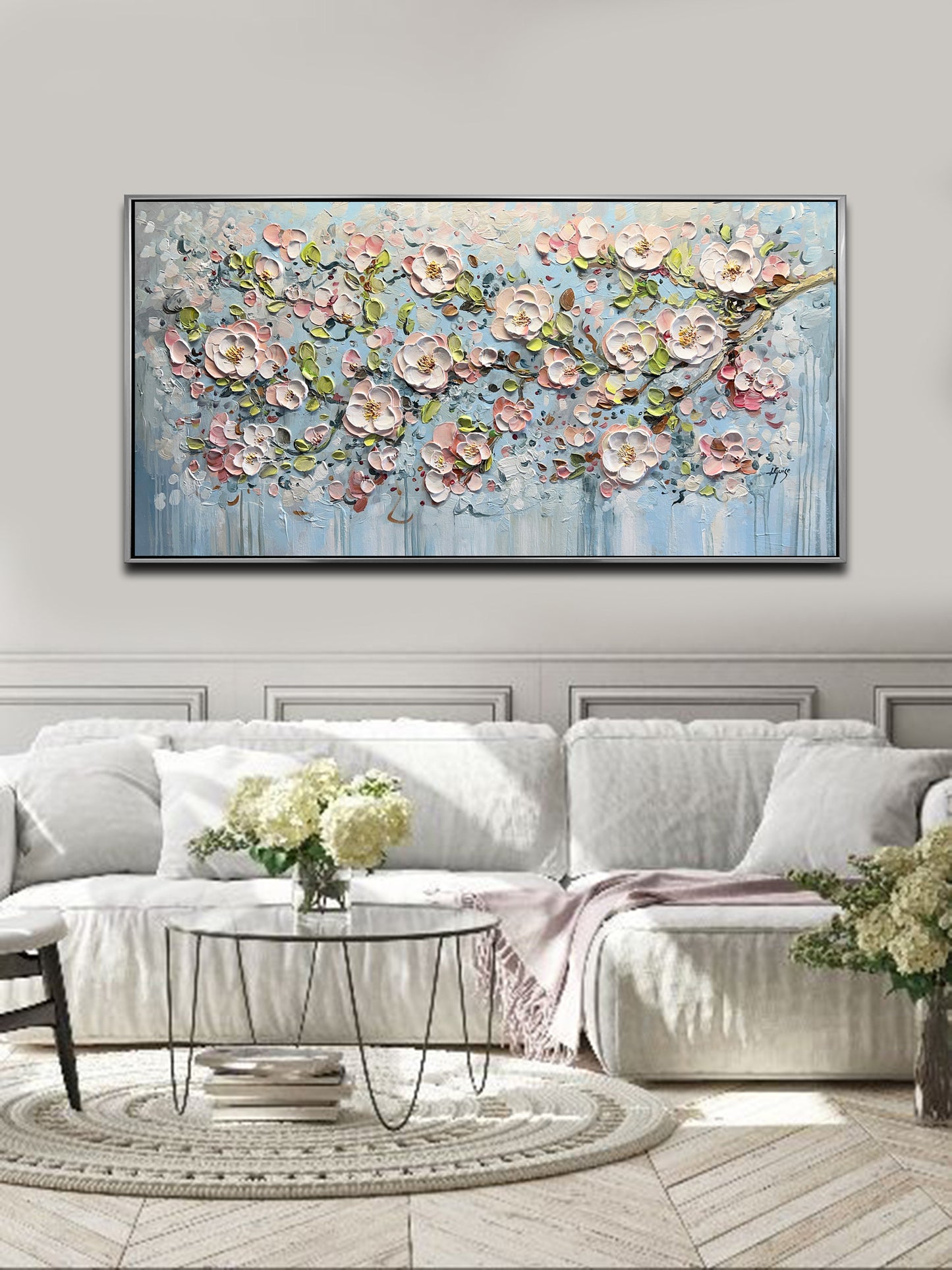 a living room with a large painting on the wall