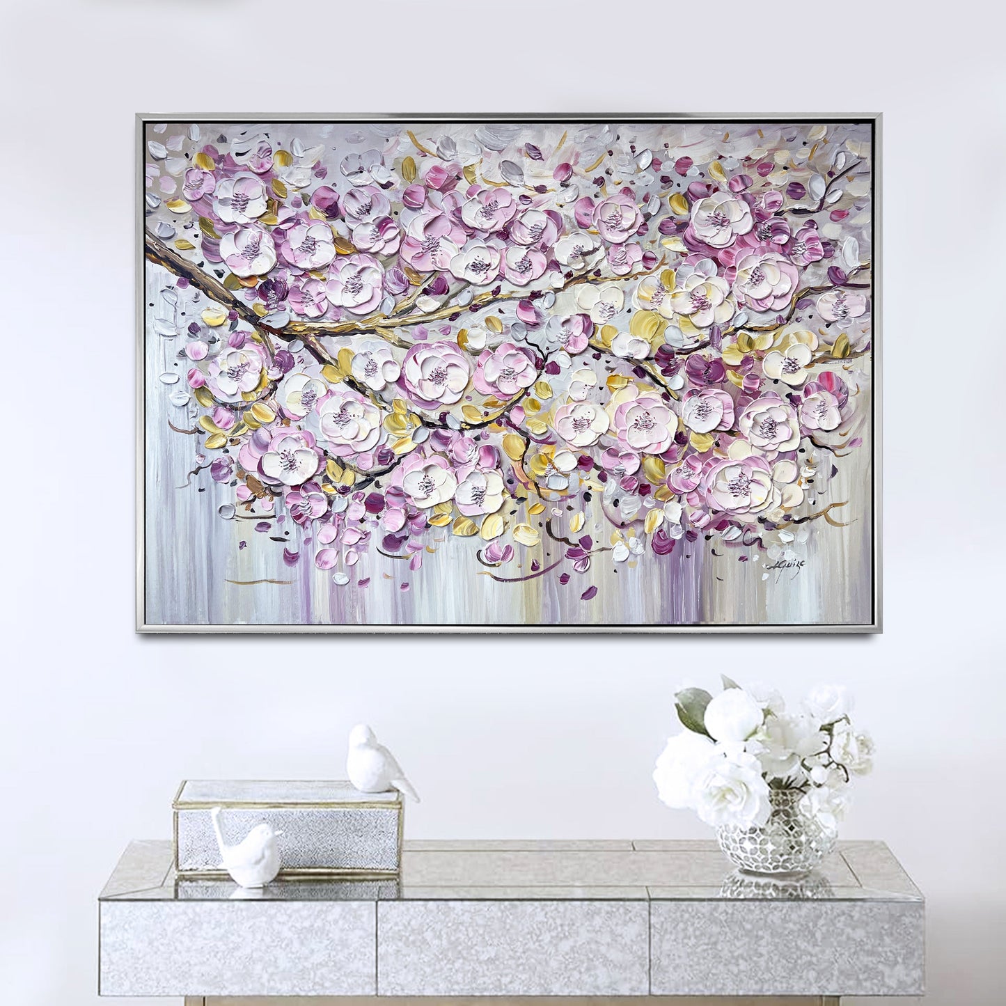 a painting on a wall above a console table