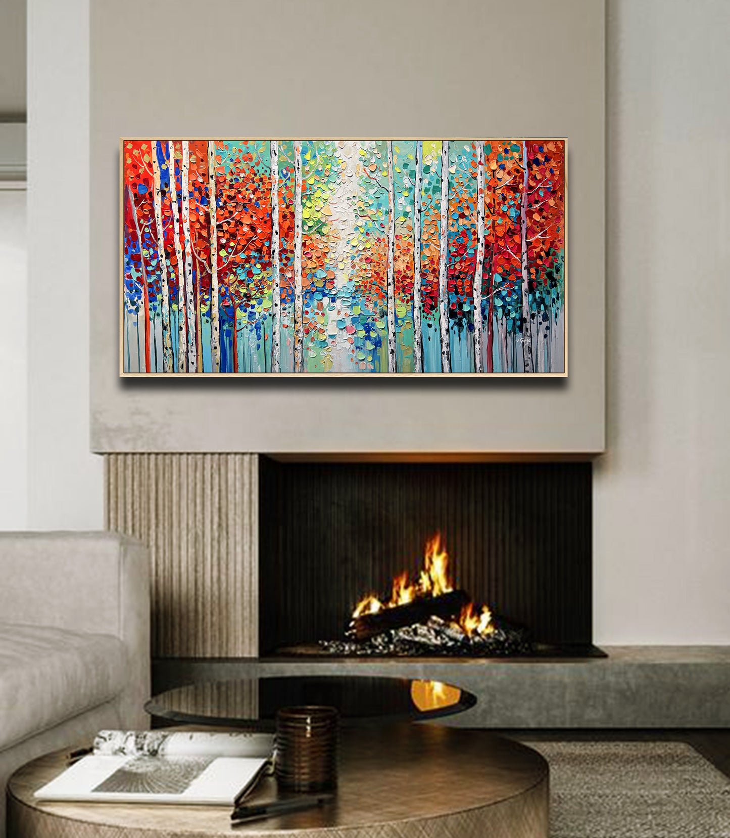 a living room with a fire place and a painting on the wall