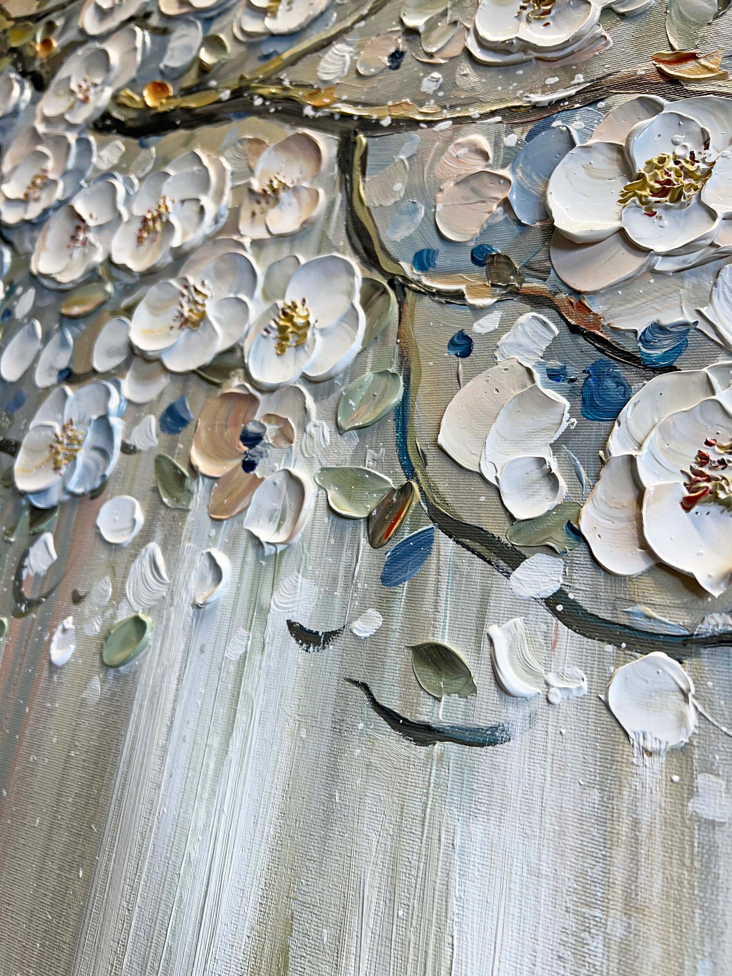 a close up of a painting with flowers on it