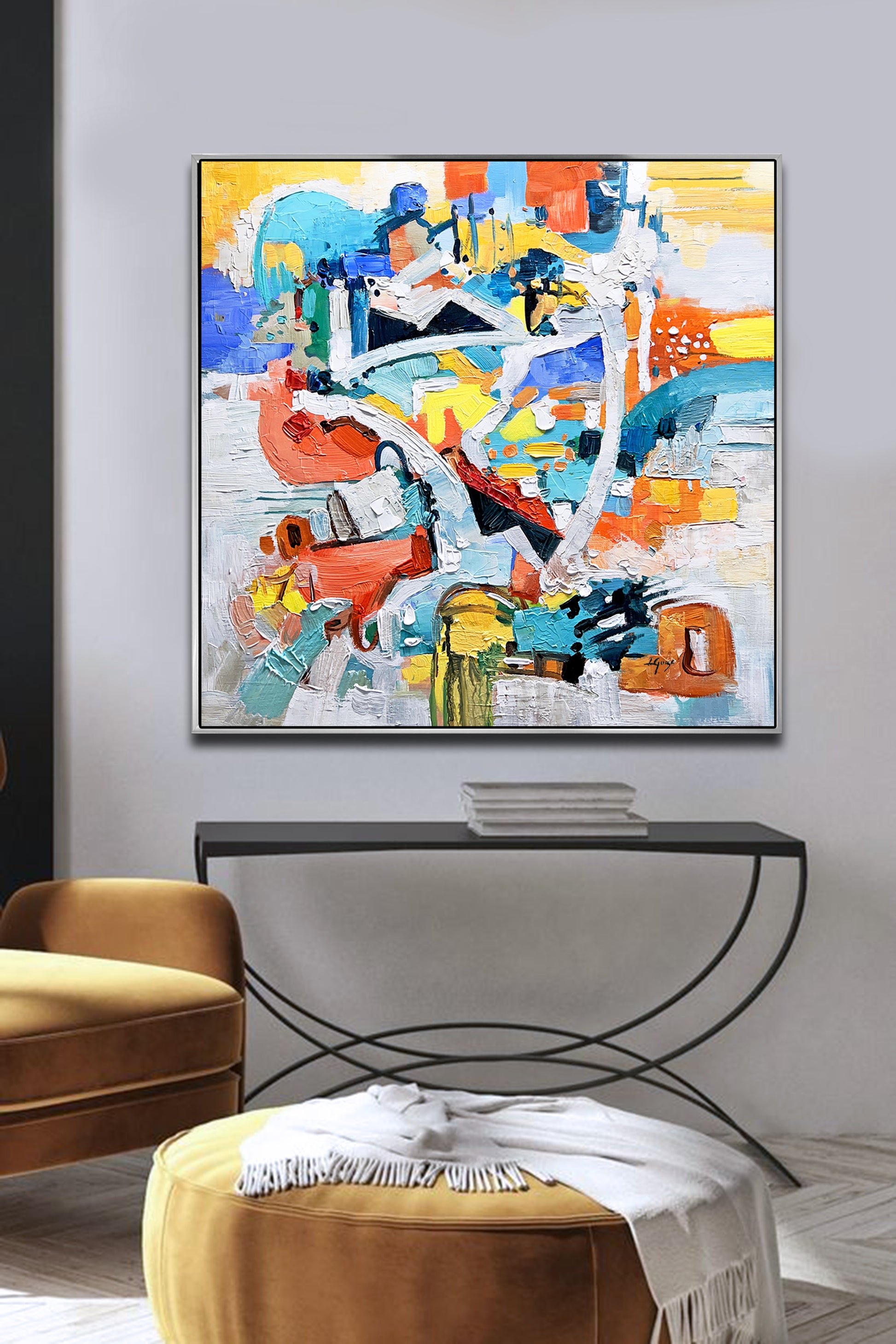 a living room with a large painting on the wall