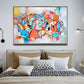 a large painting hangs above a bed in a bedroom