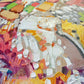 a close up of a painting with lots of paint on it