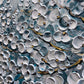 a close up of a wall covered in lots of water droplets