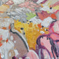 a close up of an abstract painting with lots of colors