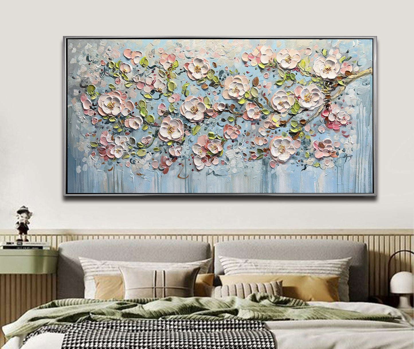 a large painting of pink flowers on a blue background