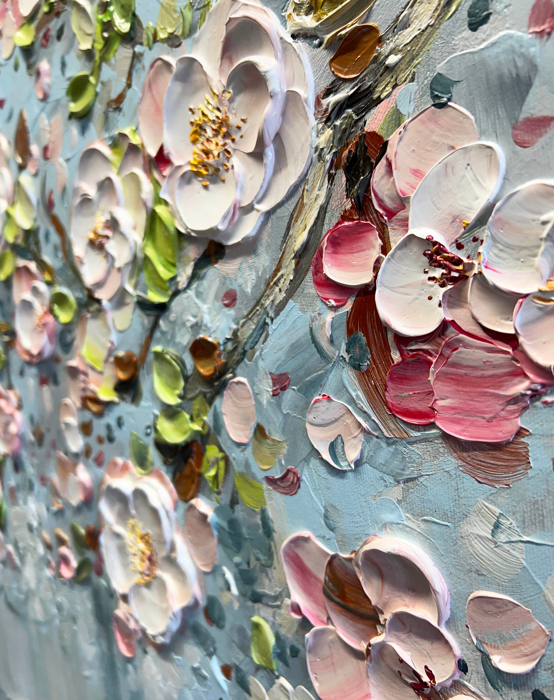 a close up of a painting with flowers on it