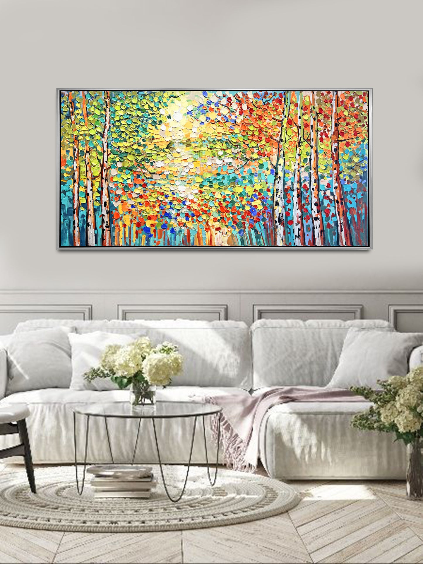 a living room with a large painting on the wall