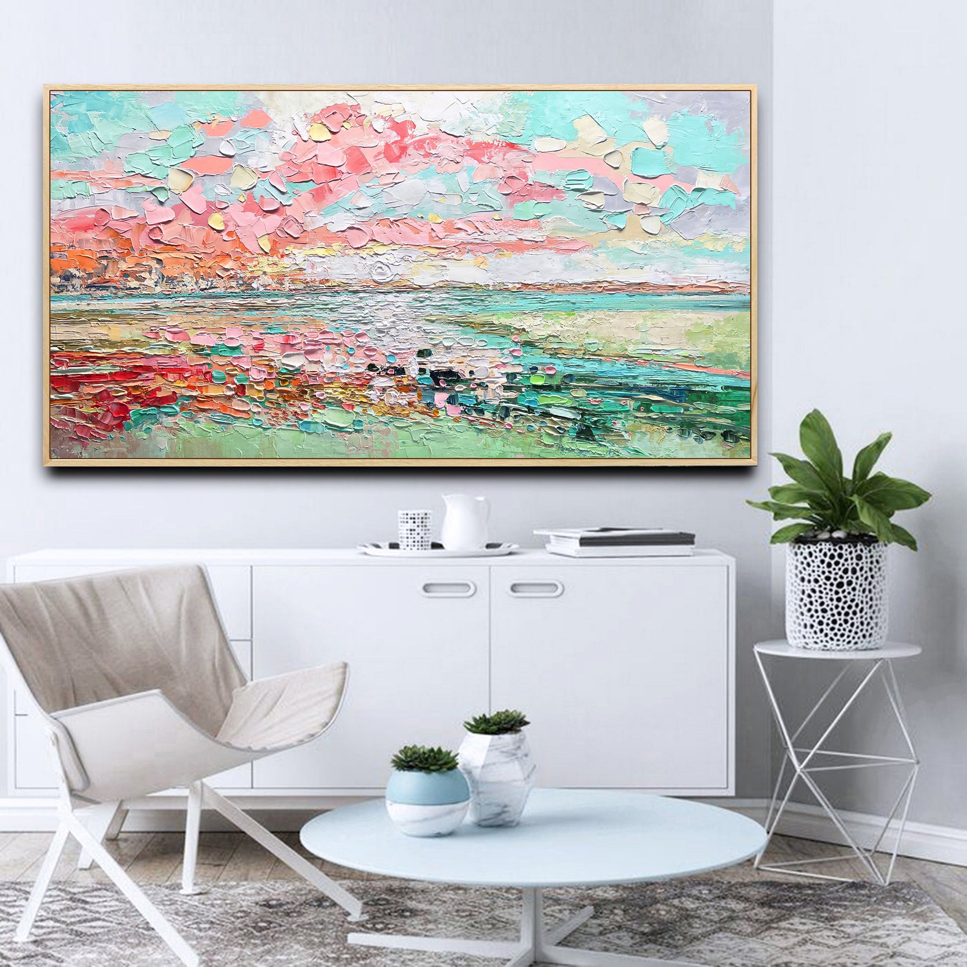 a living room with a painting on the wall