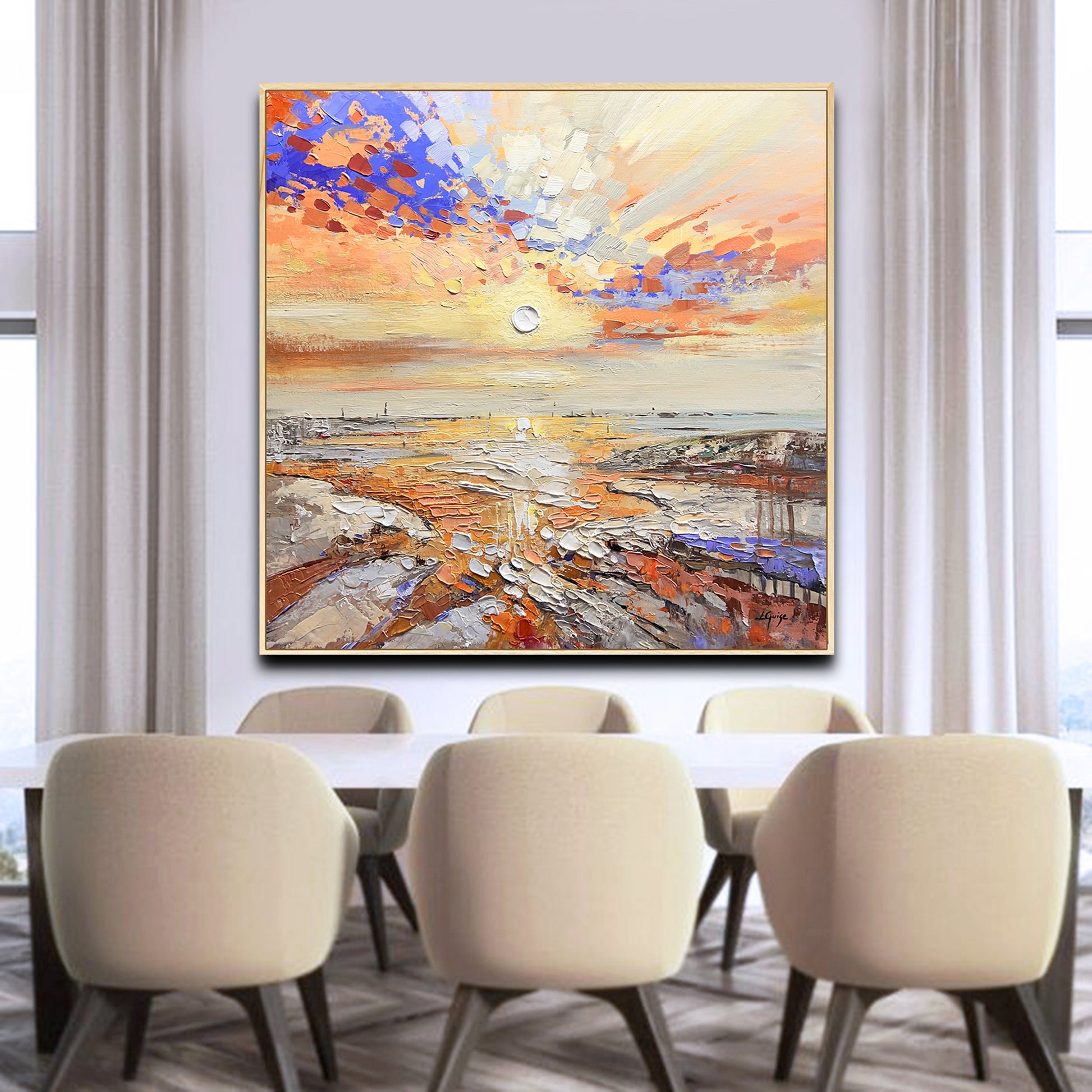 a dining room table with a painting on the wall