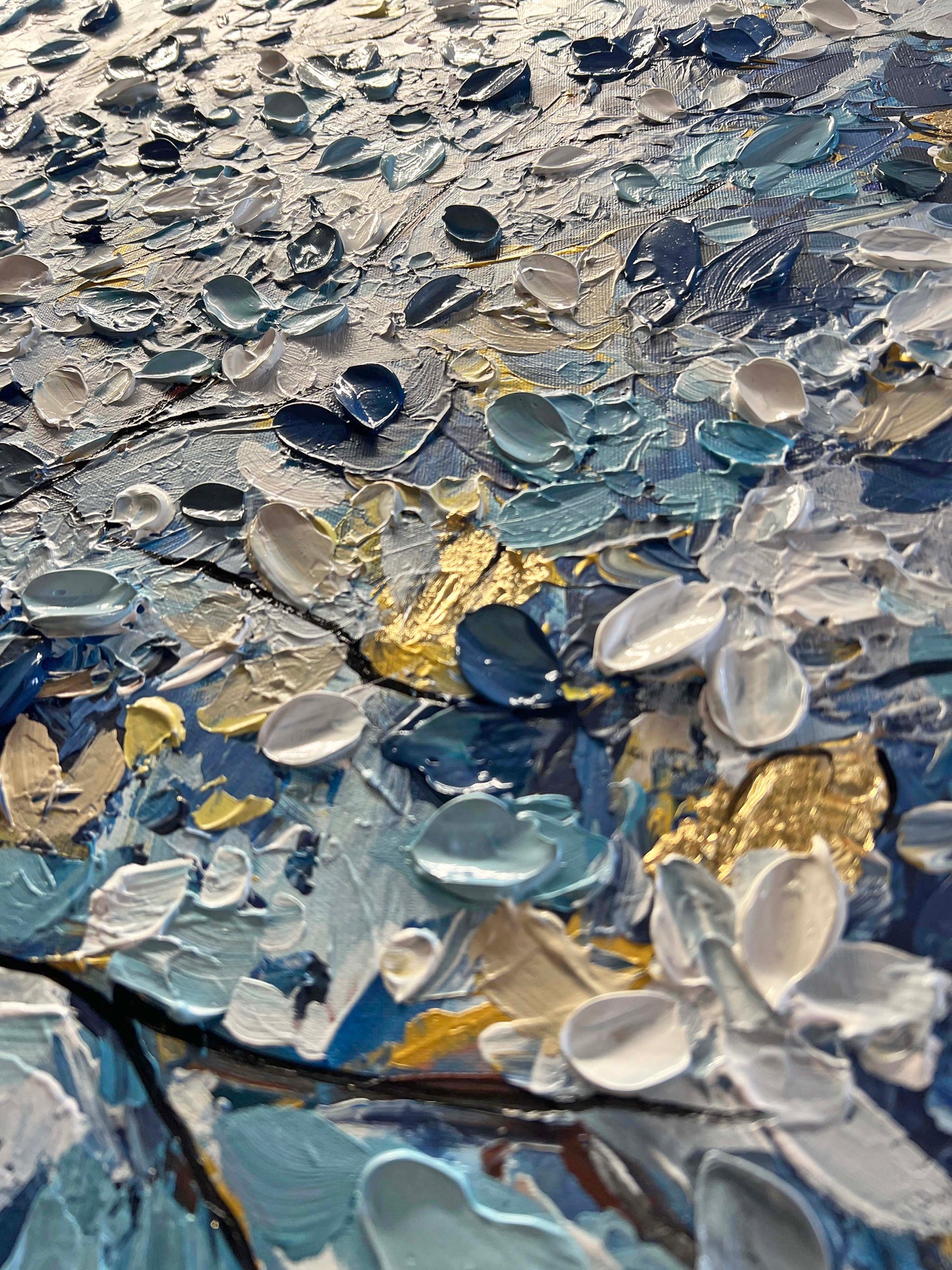 a close up of a painting with water drops on it