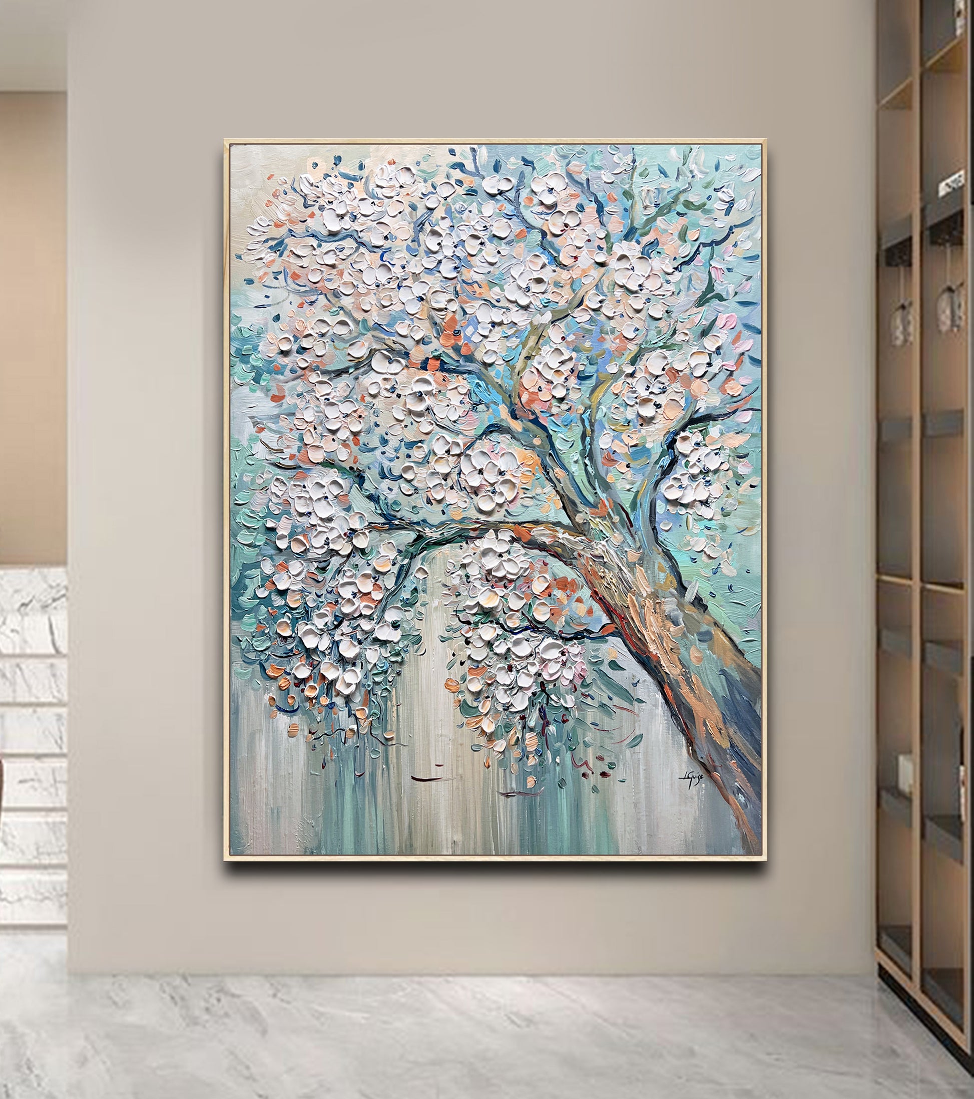 a painting of a tree in a living room