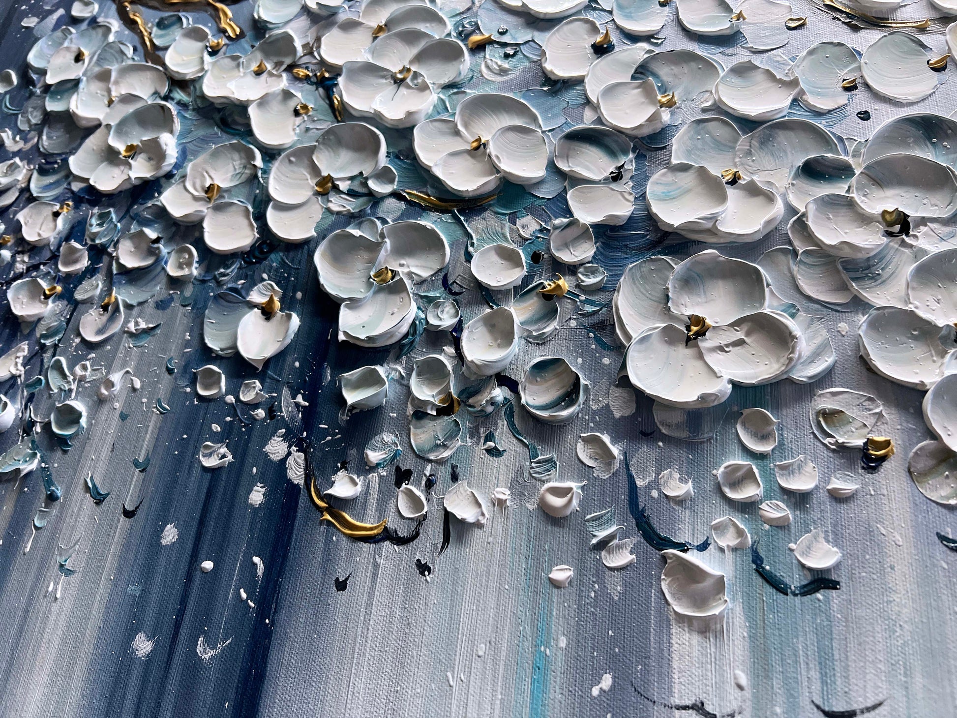 a painting of white flowers on a blue background