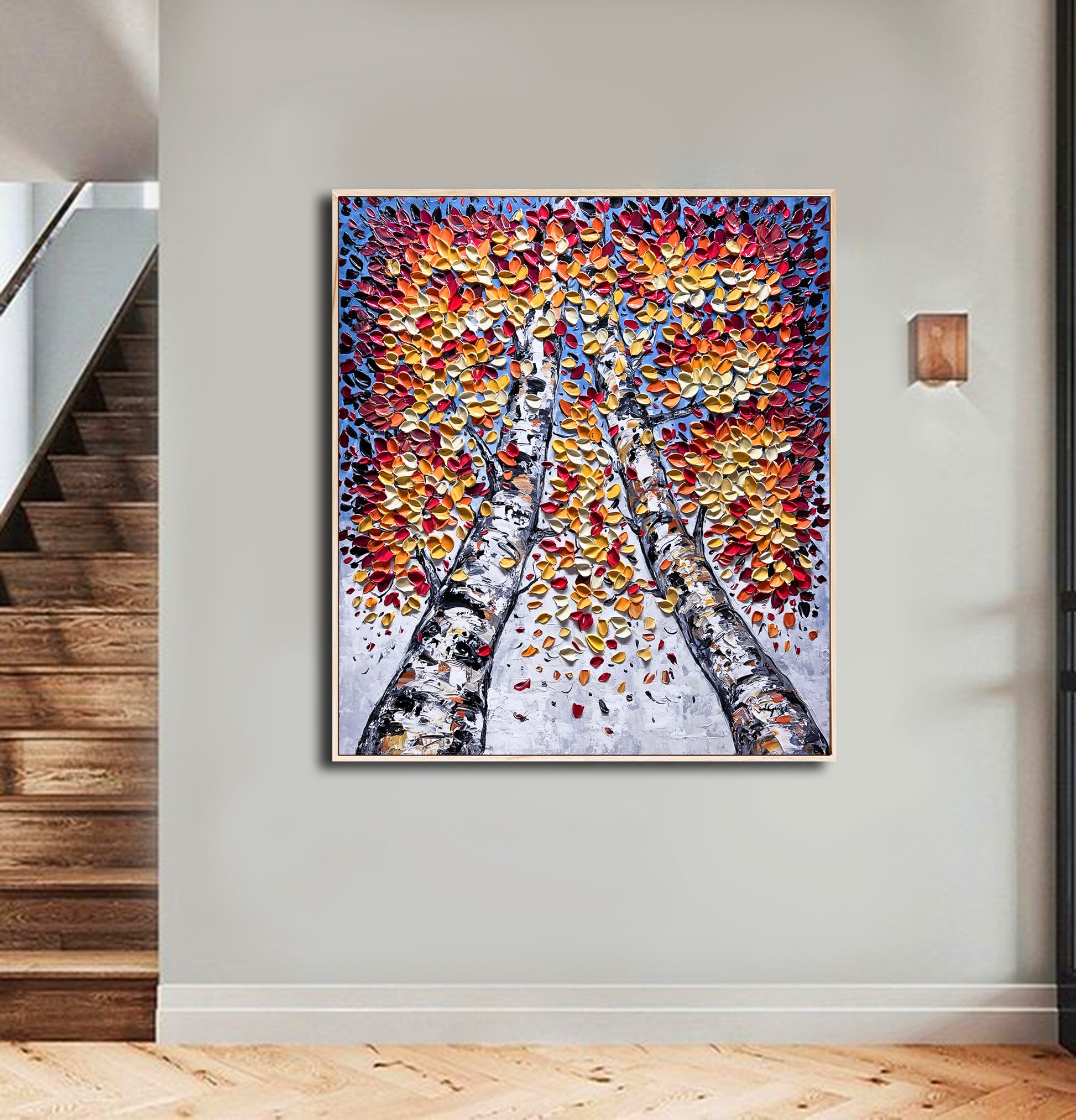 a painting hanging on a wall next to a stair case