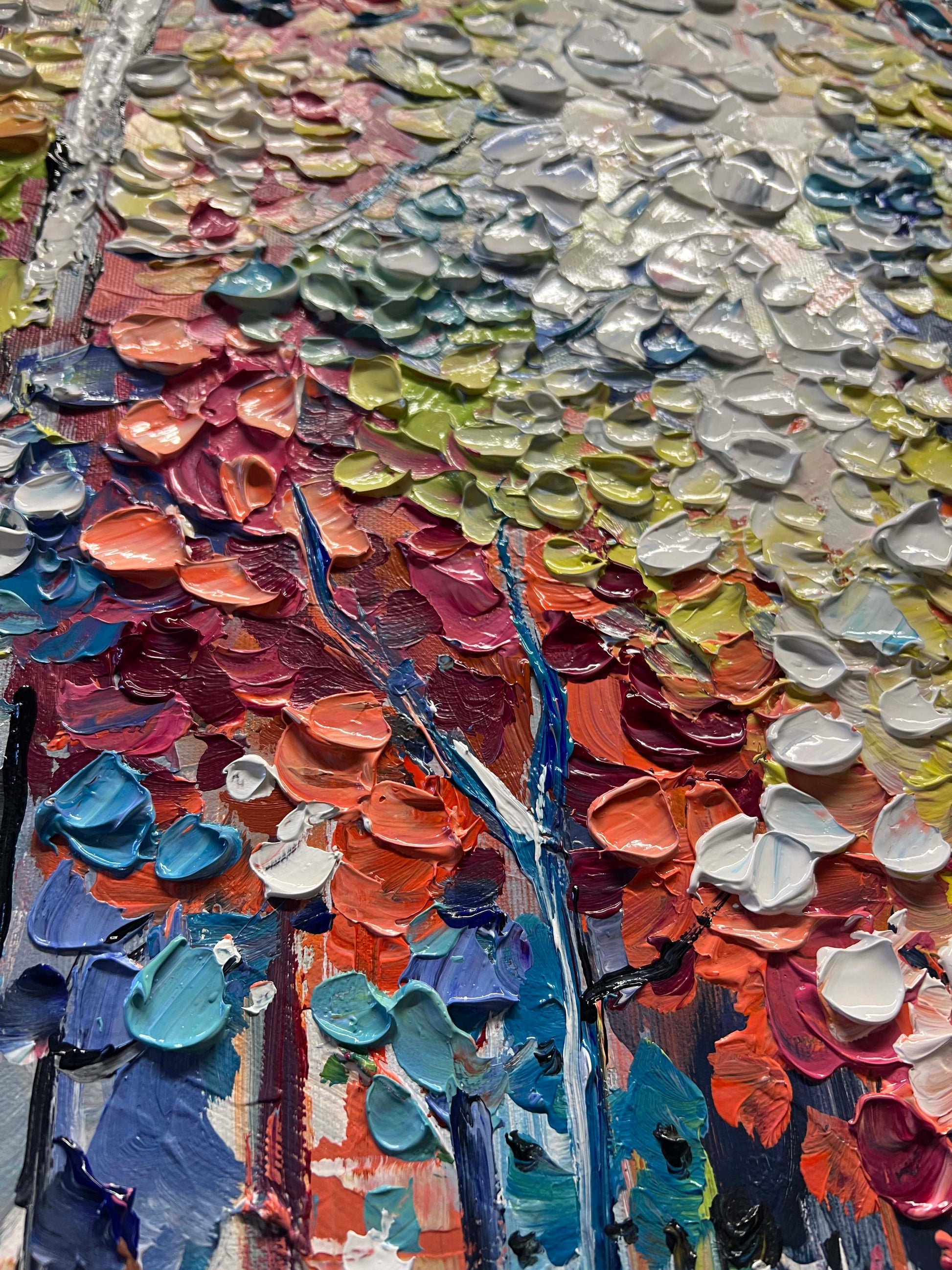 a close up of a painting with many different colors