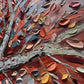 a close up of a tree with lots of leaves on it