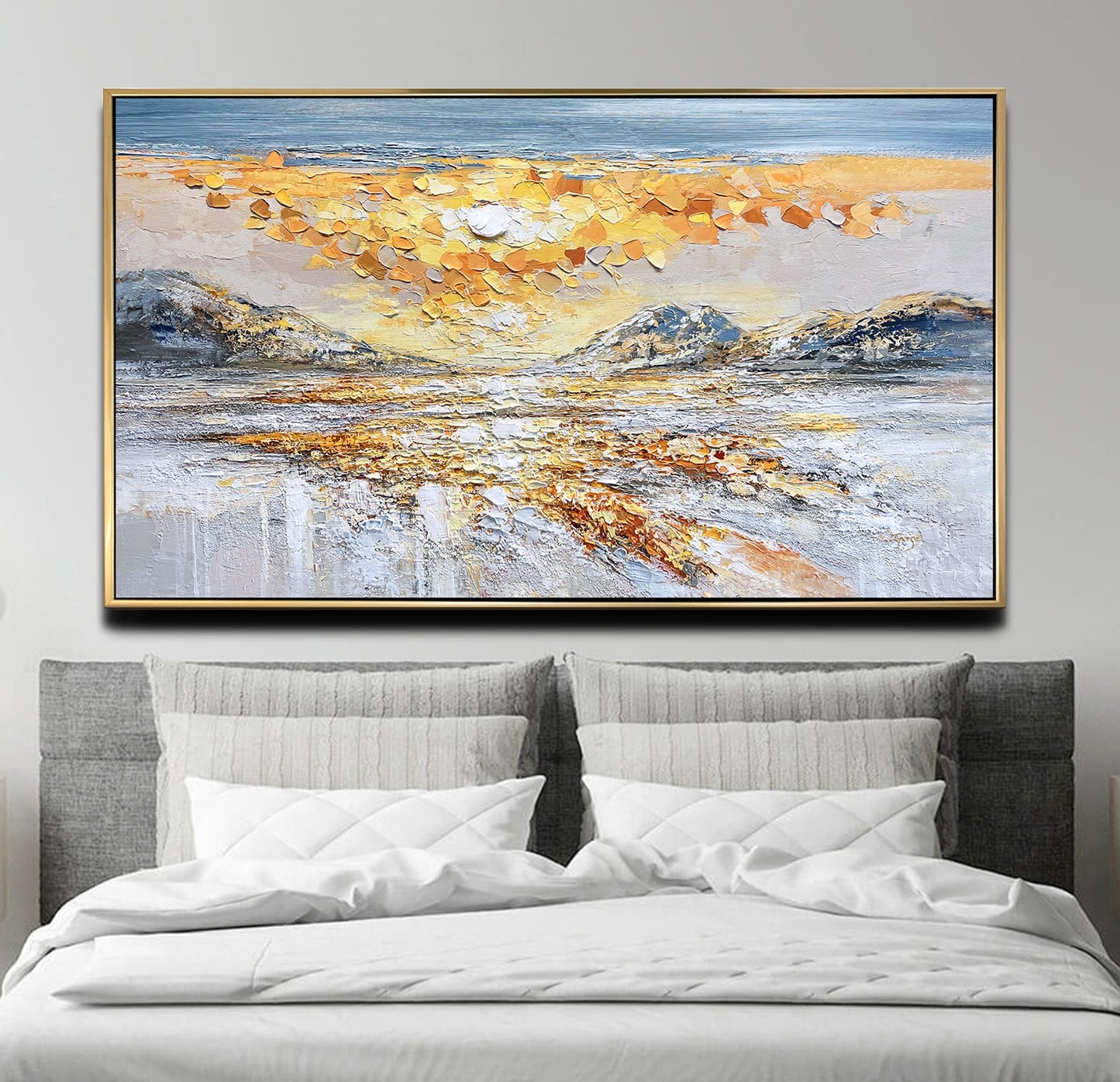 a large painting on a wall above a bed