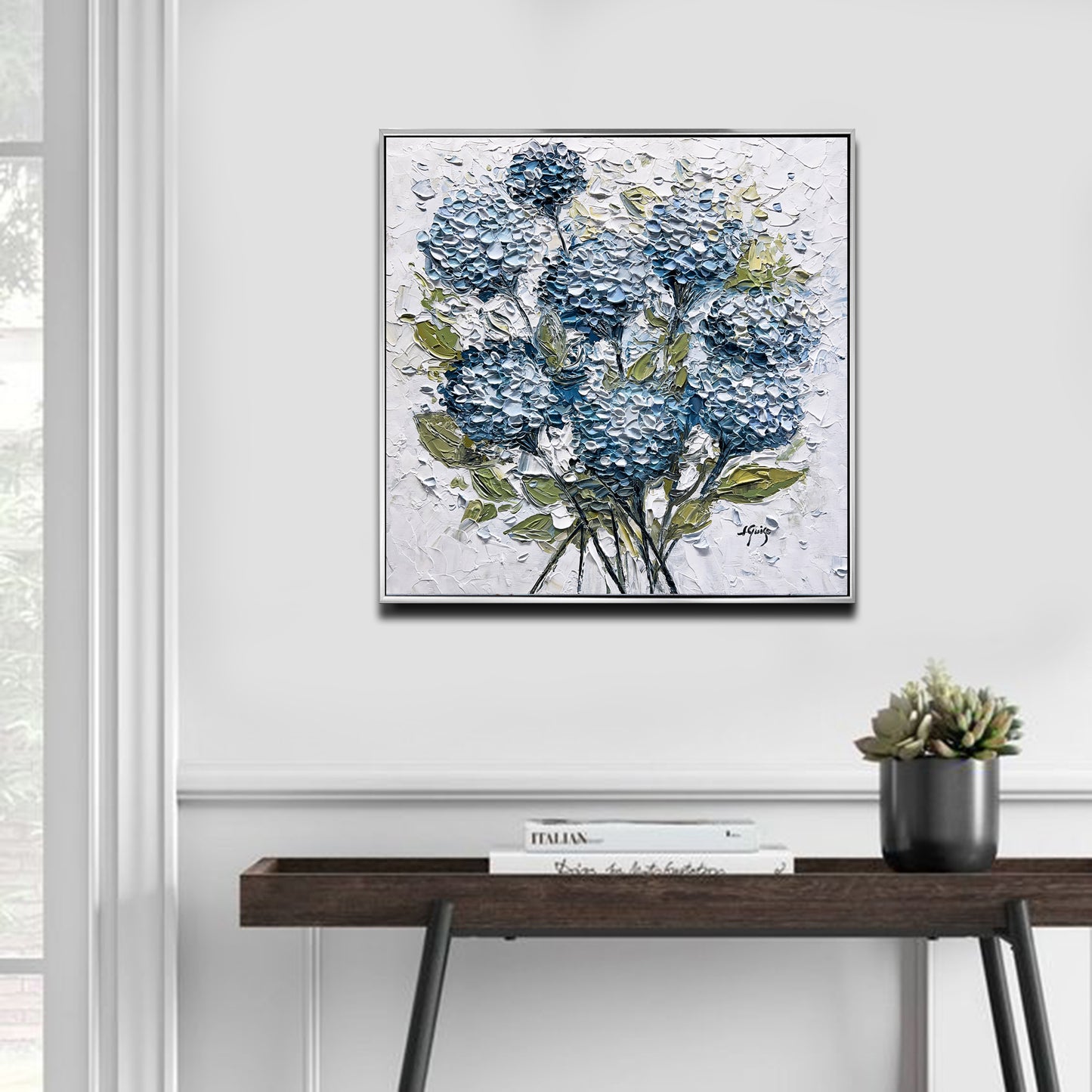 a painting of blue flowers on a white wall