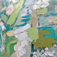 a close up of an abstract painting with green and blue colors