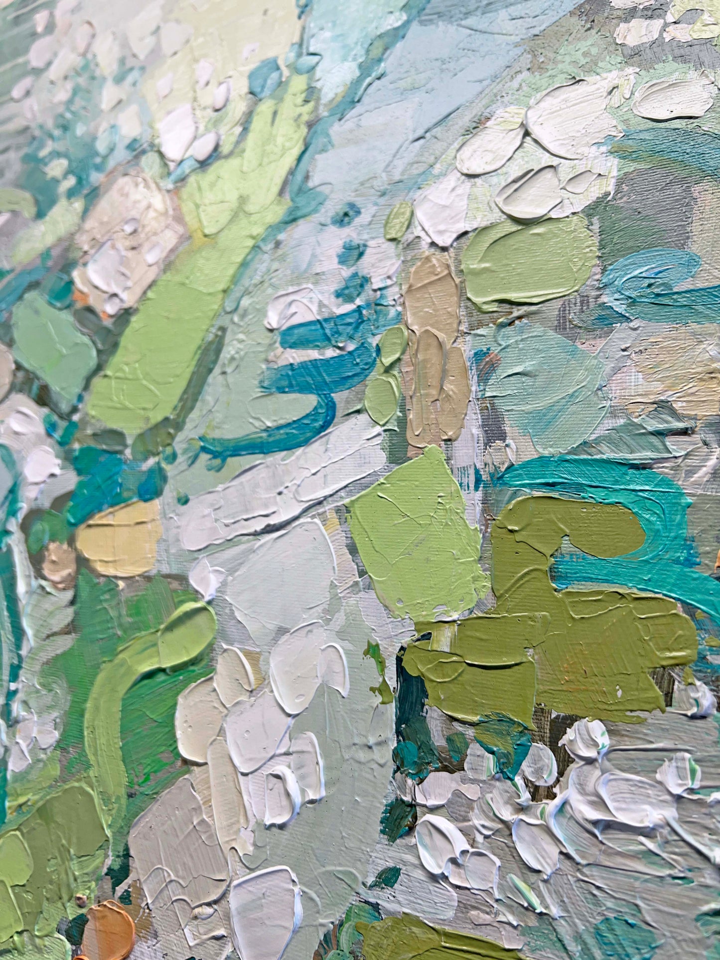 a close up of an abstract painting with green and blue colors