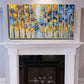 a fireplace with a painting on the mantle