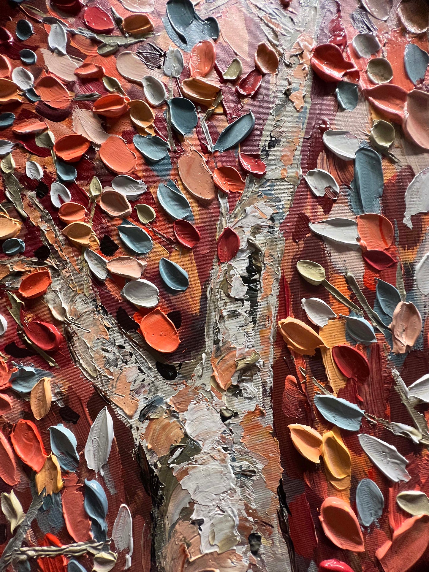 a close up of a tree trunk with lots of paint on it