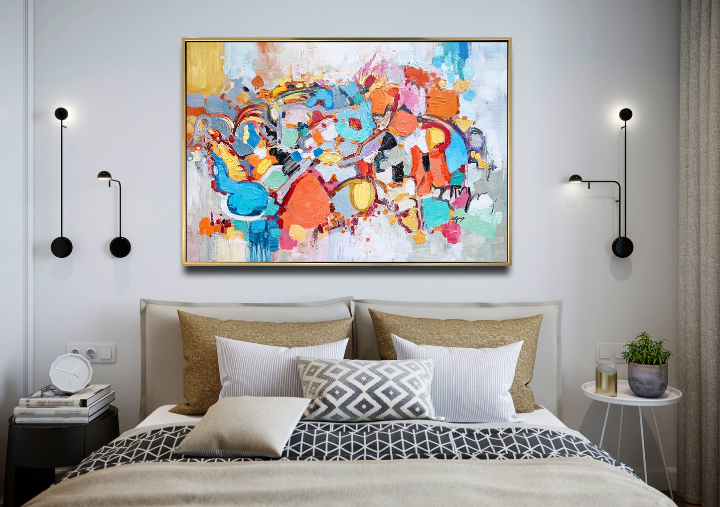 a large painting hangs above a bed in a bedroom