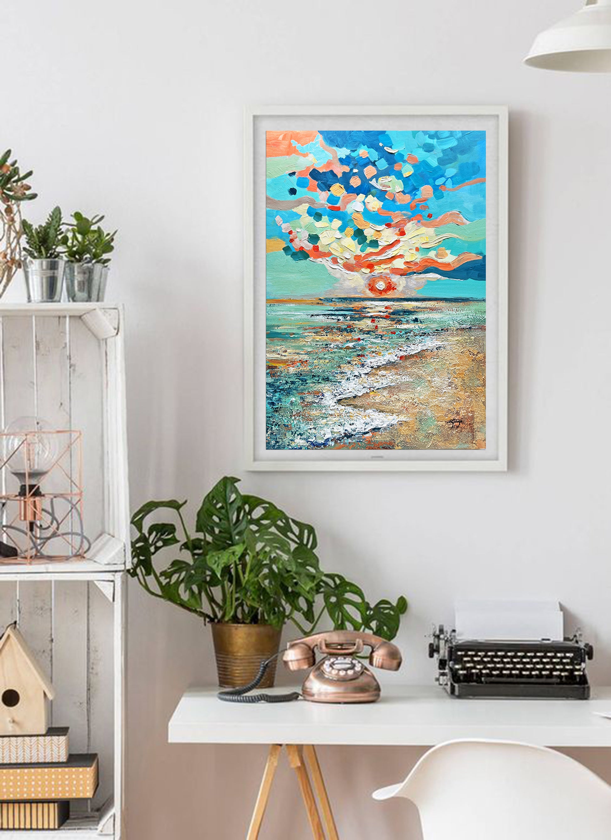 a painting on a wall above a desk